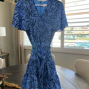 Super cute, faux wrap front, tie belt. Never worn. Beautiful blue print.